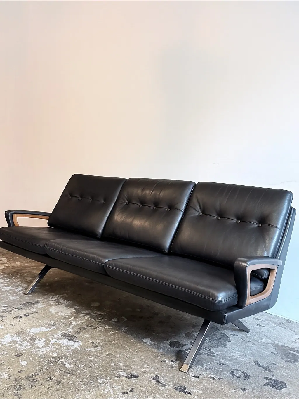 Carl Straub three-seater sofa, black leather